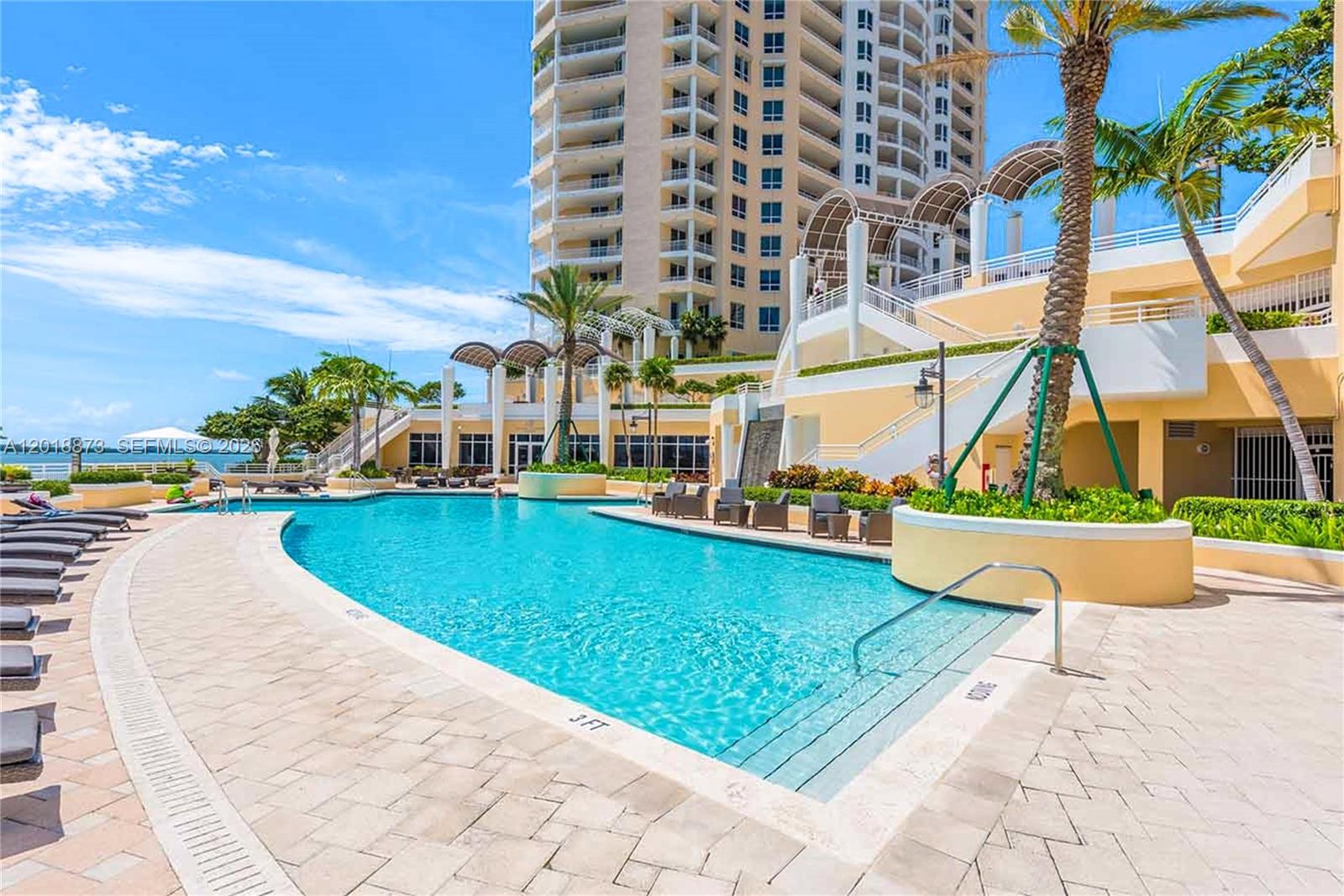 848 Brickell Key Drive, Unit 2703 Miami, FL 33131 - Photo 25 of 30 a view of swimming pool with outdoor space and seating area