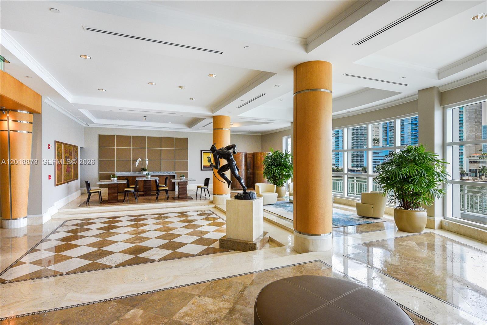 848 Brickell Key Drive, Unit 2703 Miami, FL 33131 - Photo 28 of 30 a view of a living room and dining room