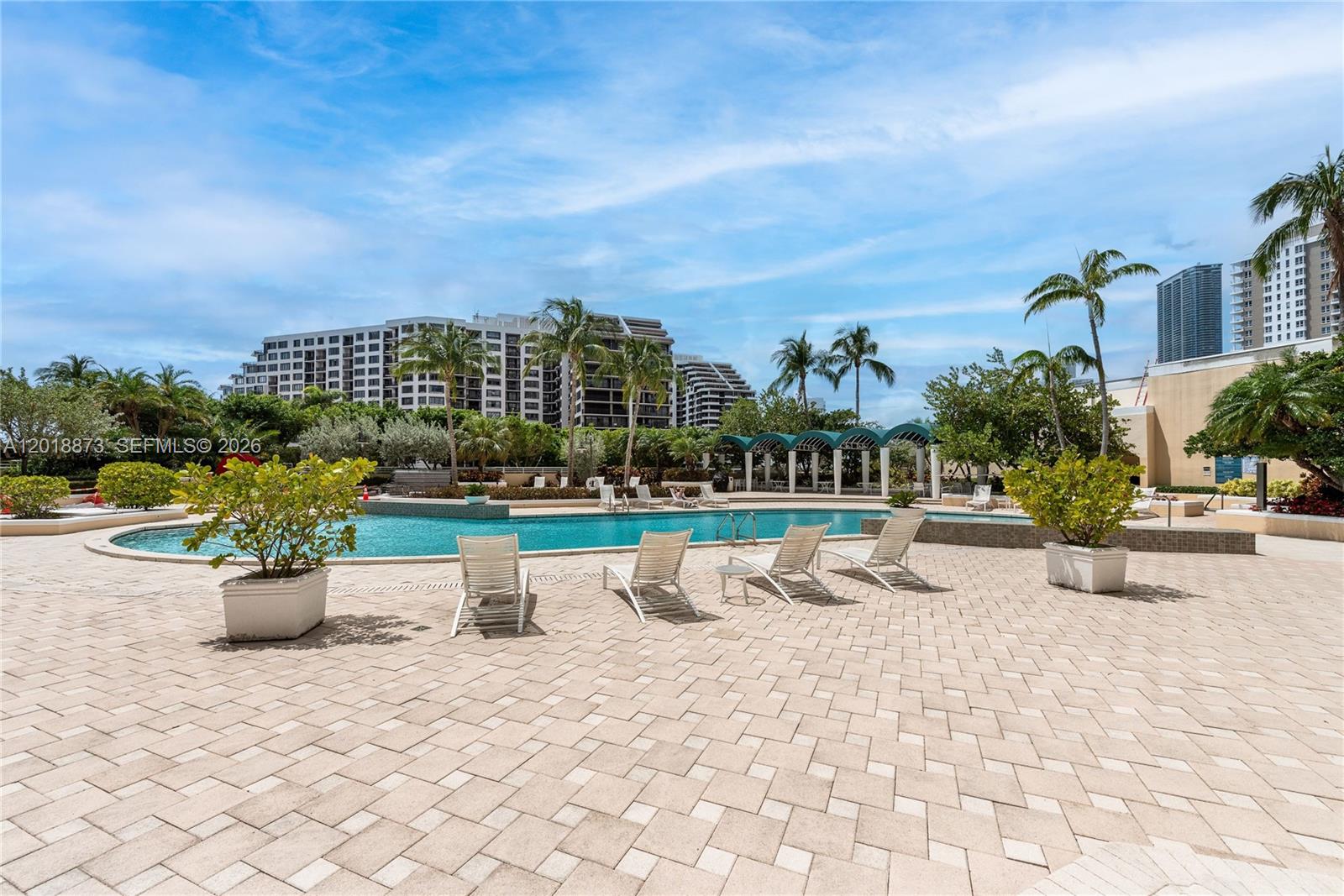 848 Brickell Key Drive, Unit 2703 Miami, FL 33131 - Photo 30 of 30 a view of a terrace with chairs and a potted plant