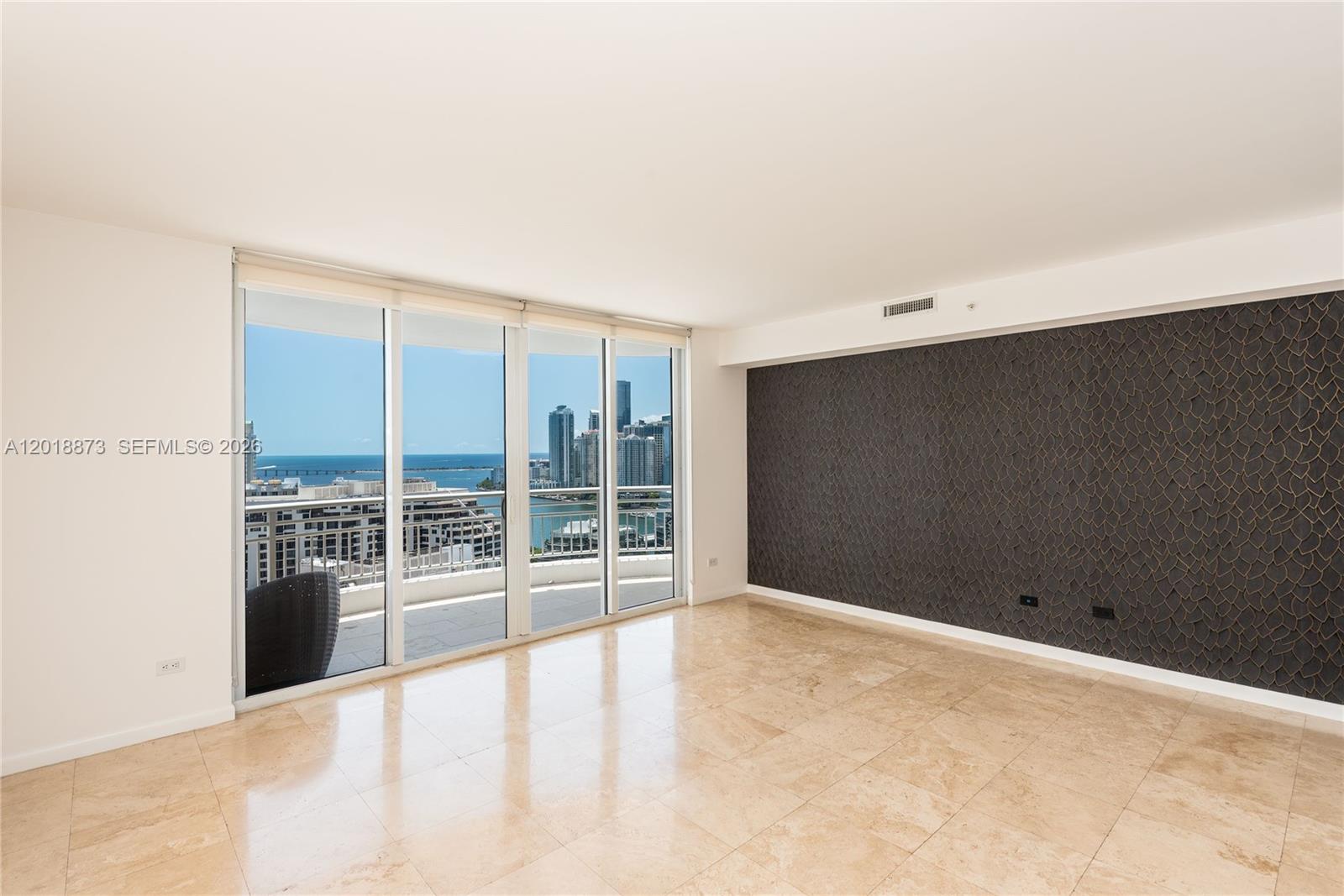 848 Brickell Key Drive, Unit 2703 Miami, FL 33131 - Photo 4 of 30 a view of an empty room with a window