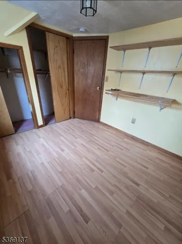 a view of a house with a small yard and plants