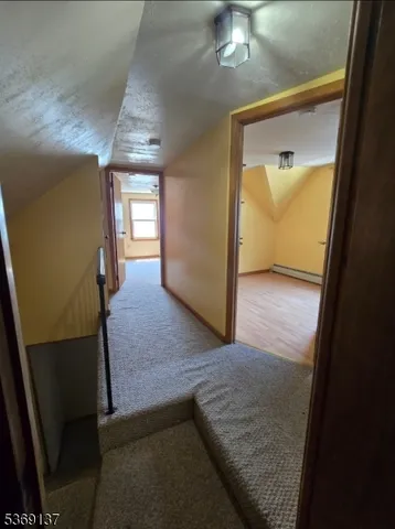 a view of an empty room and a window