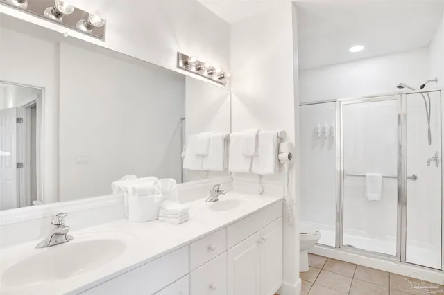 a bathroom with a sink double vanity and a mirror