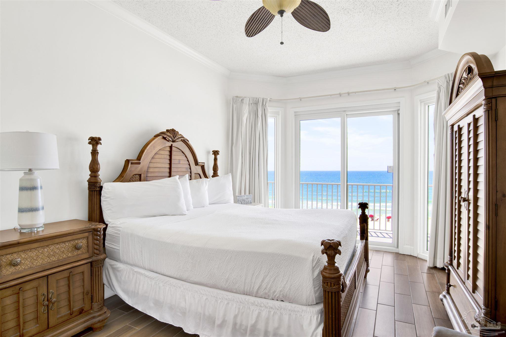 14511 Perdido Key Drive, Unit 408 Perdido Key, FL 32507 - Photo 19 of 43 a bedroom with a bed next to a large window with the outer view