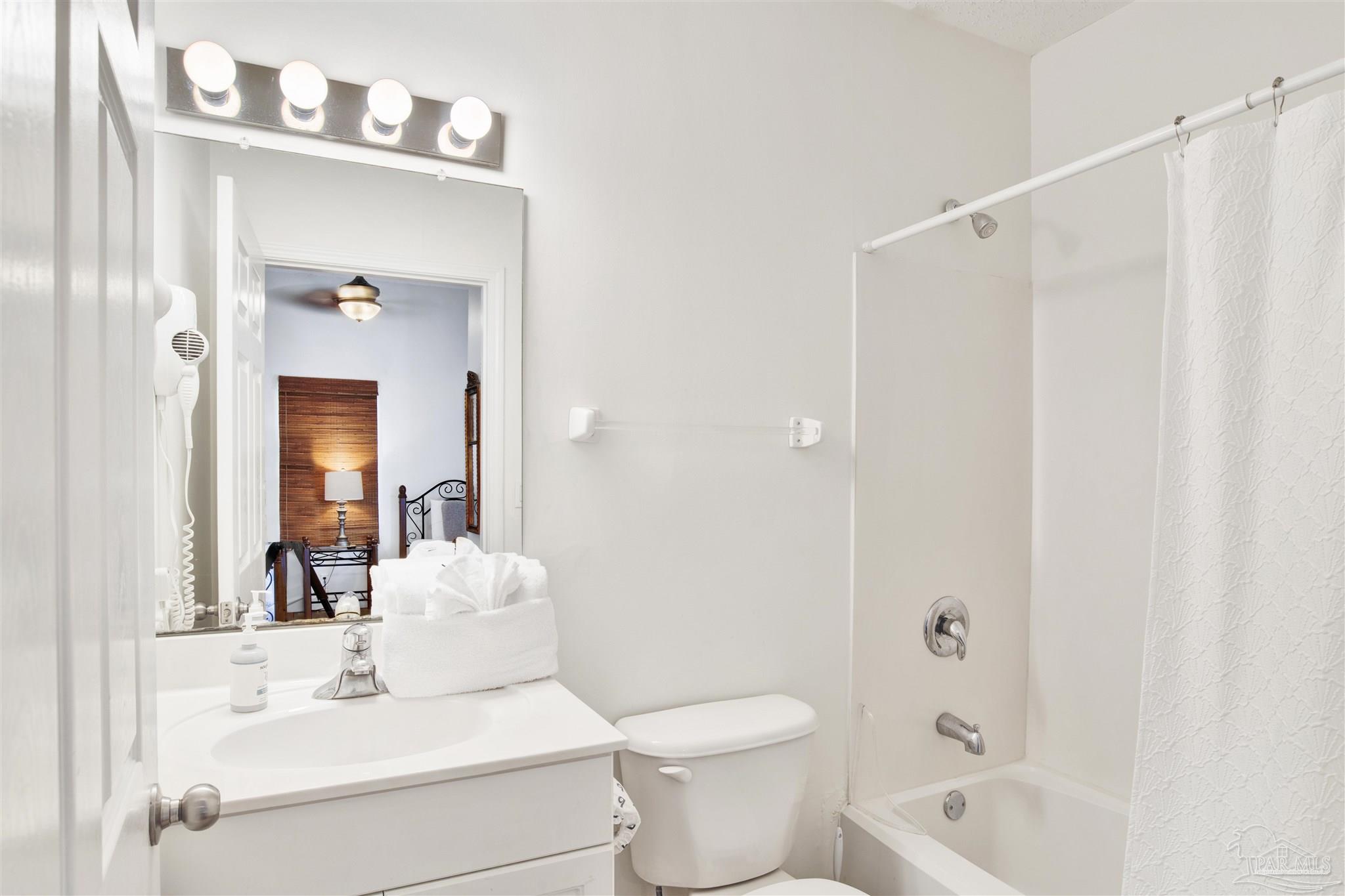 14511 Perdido Key Drive, Unit 408 Perdido Key, FL 32507 - Photo 24 of 43 a bathroom with a sink toilet and shower