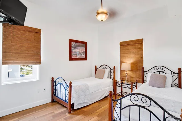 a bedroom with furniture and a window