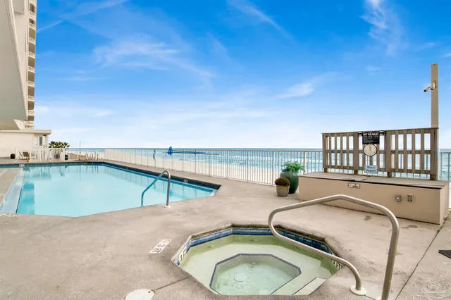 a view of a swimming pool with a lounge chair