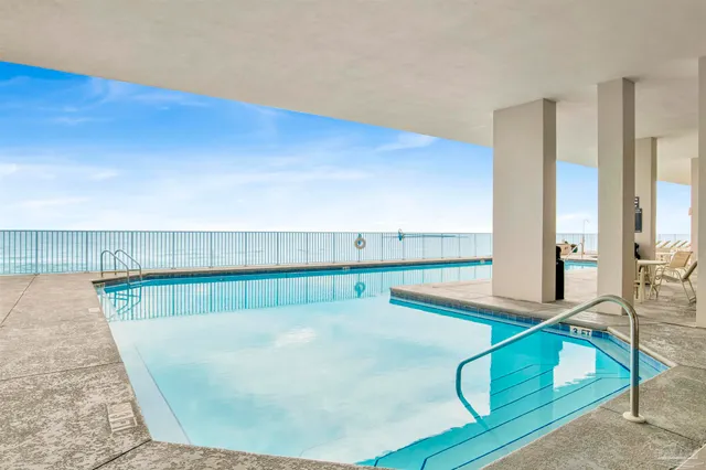 a view of a living room and kitchen