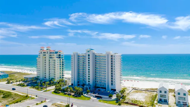 a view of ocean with a multi story building