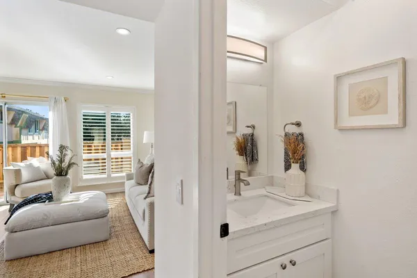 a en suite bathroom with a sink and a mirror