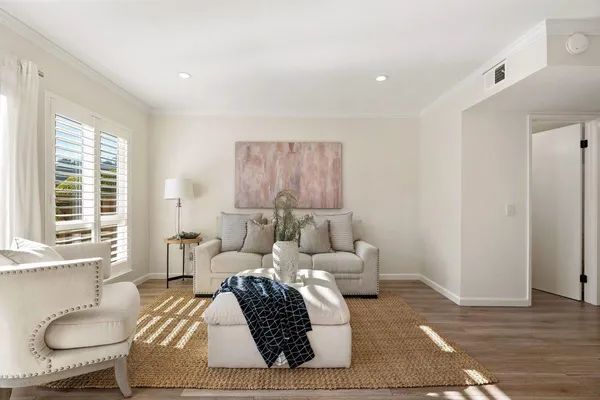 a living room with furniture and a window