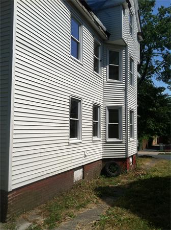 46-48 Windsor Street Springfield, MA 01105 - Photo 5 of 7 a view of a house with a yard