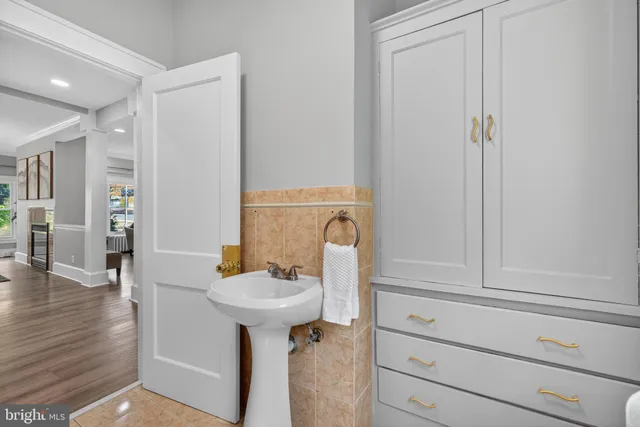 a bathroom with a sink a toilet and bathtub