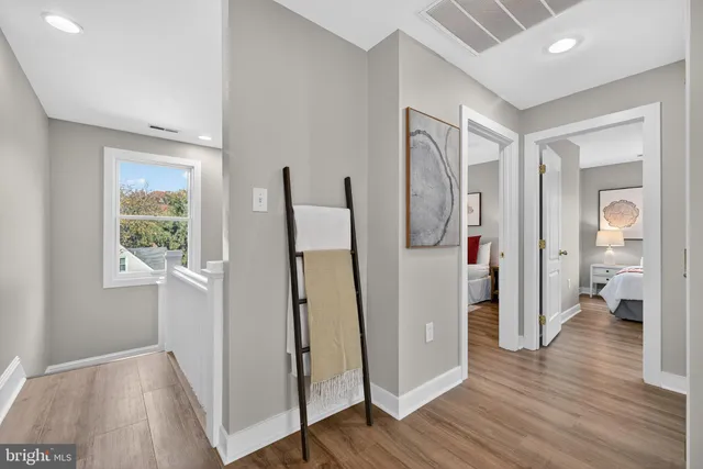 a view of balcony with wooden floor