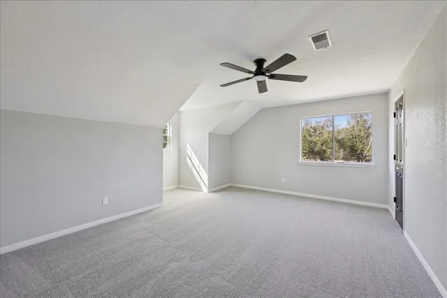 a view of room with a ceiling fan