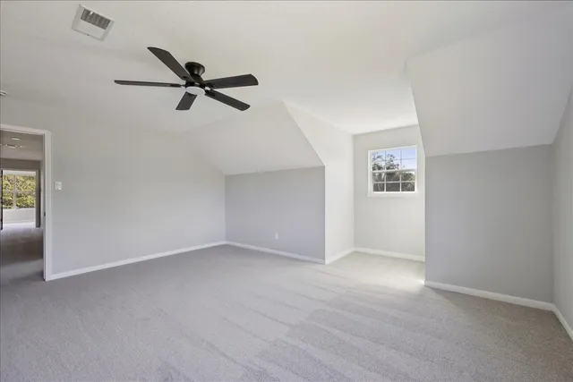 a bathroom with a double vanity sink a mirror and a bathtub