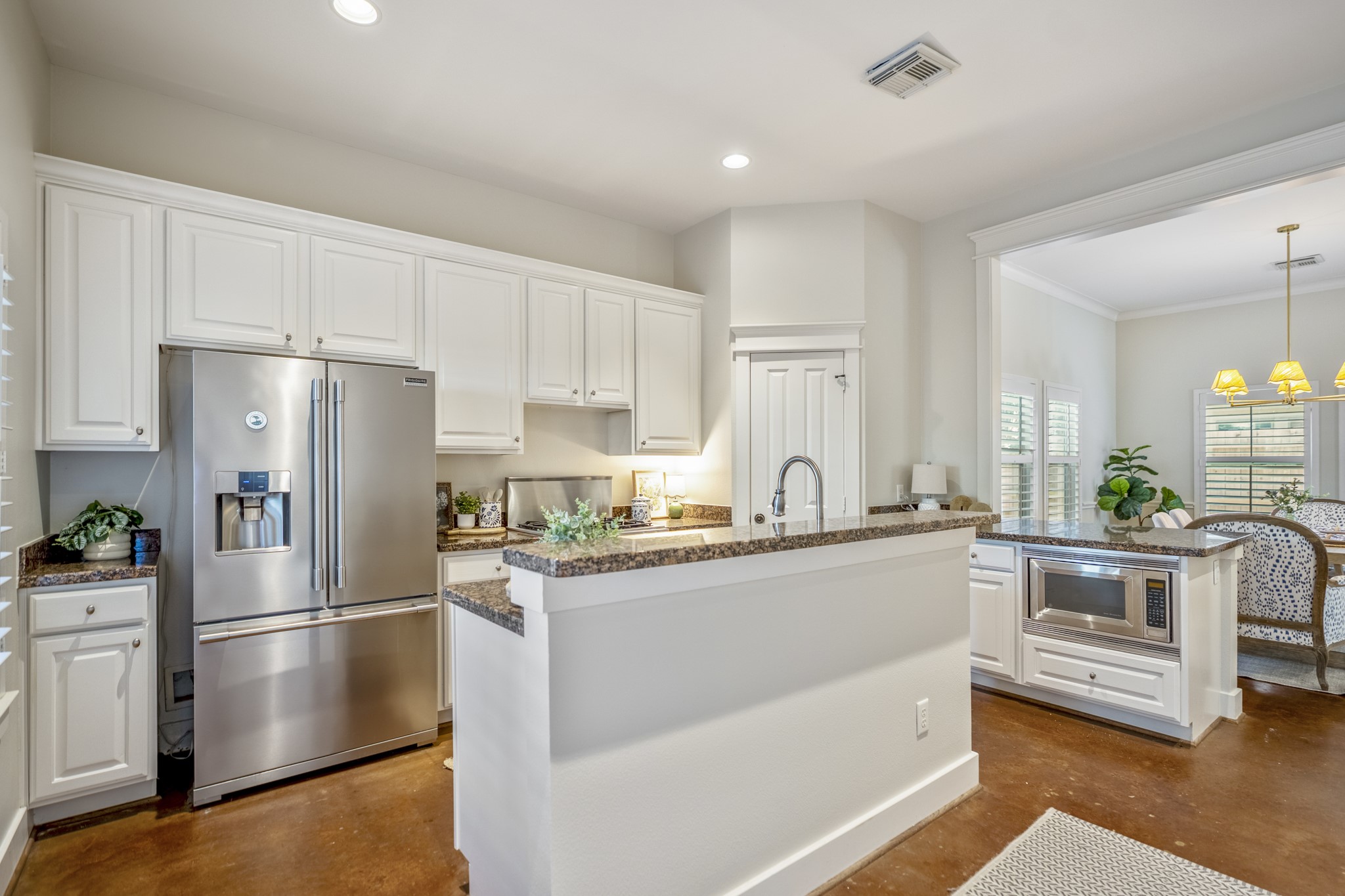 905 West 23rd Street Houston, TX 77008 - Photo 11 of 46 Designed for everyday convenience with ample cabinetry, prep space, and entertaining potential.