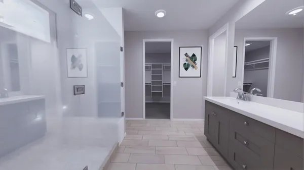 a spacious bathroom with a tub sink and mirror
