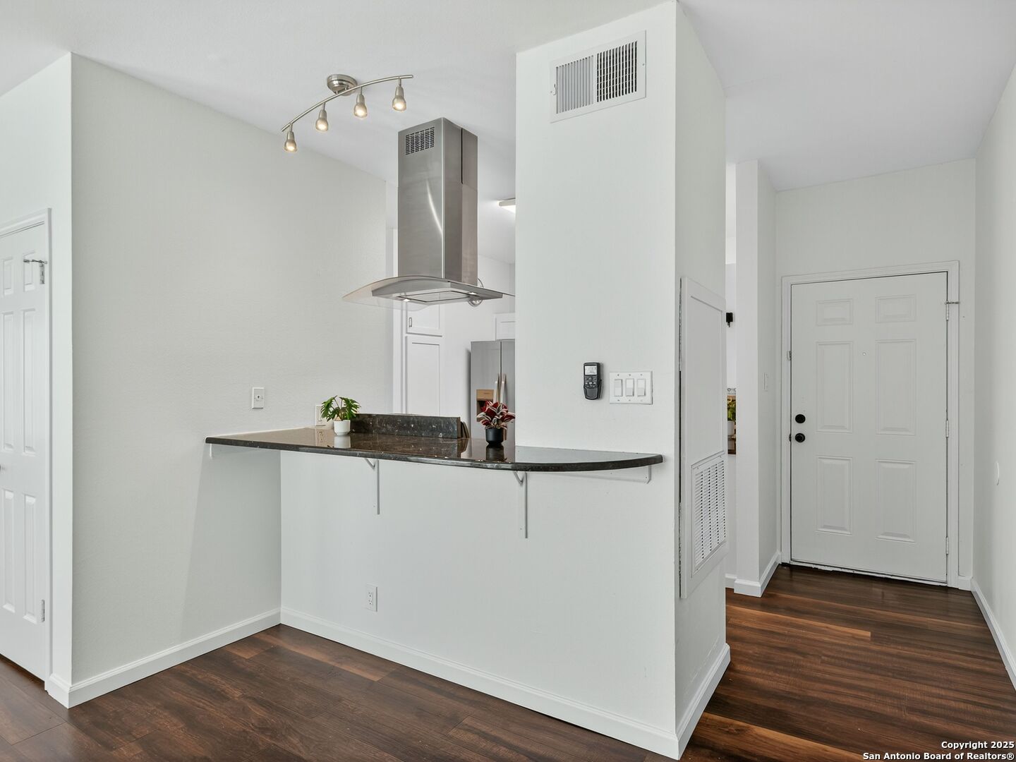2414 Longview Street, Unit 307 Austin, TX 78705 - Photo 12 of 26 a view of a hallway with wooden floor