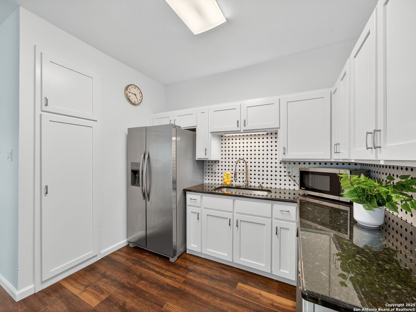 2414 Longview Street, Unit 307 Austin, TX 78705 - Photo 15 of 26 a kitchen with stainless steel appliances a refrigerator sink and stove