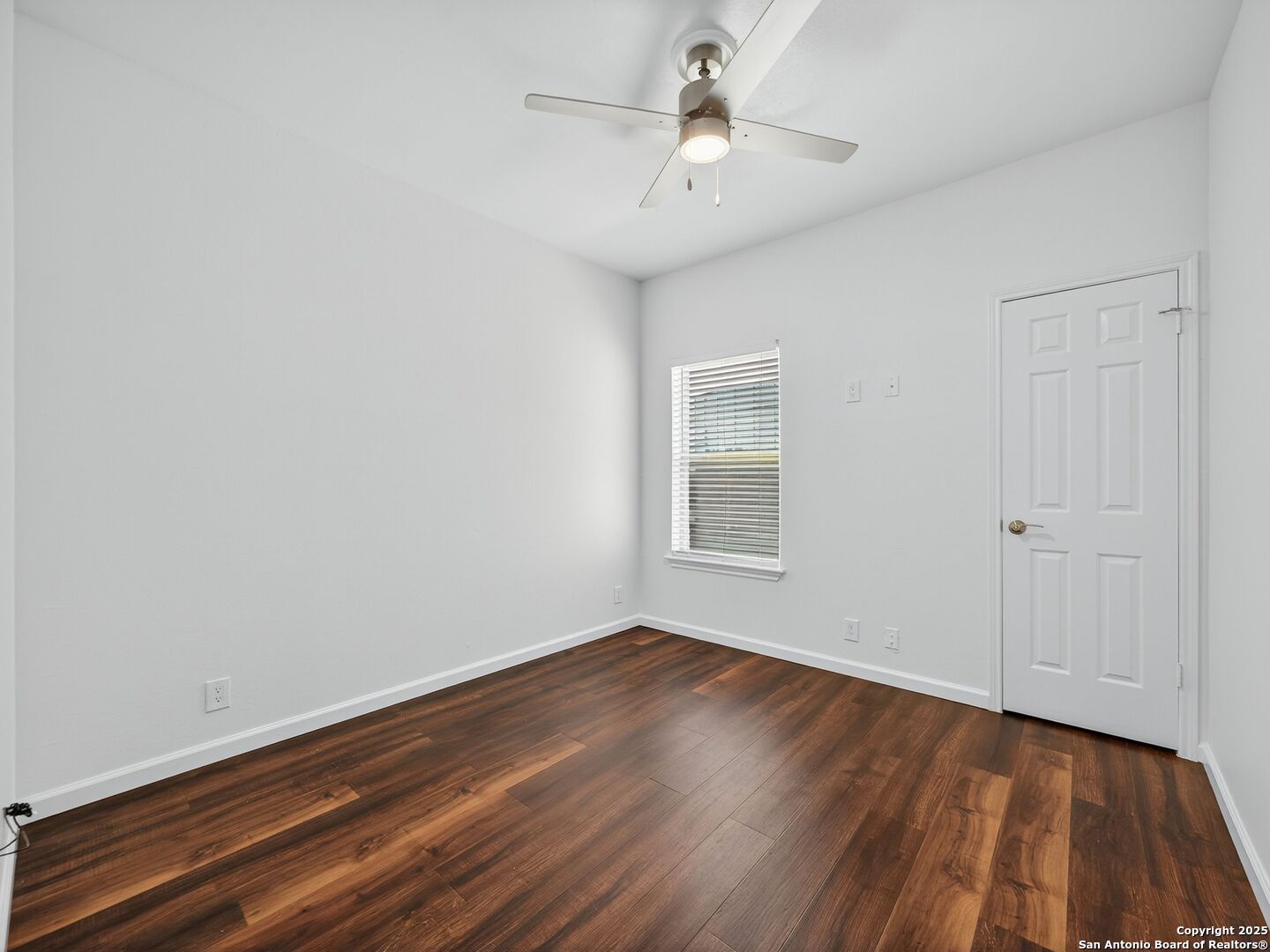 2414 Longview Street, Unit 307 Austin, TX 78705 - Photo 20 of 26 wooden floor in an empty room with a window