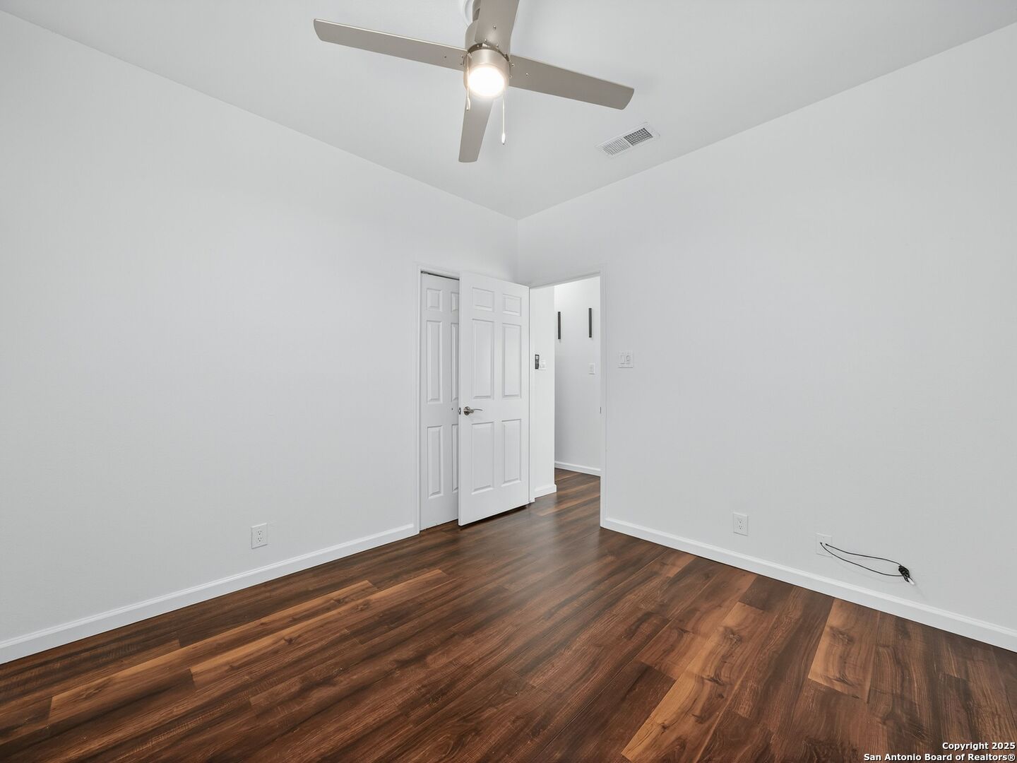 2414 Longview Street, Unit 307 Austin, TX 78705 - Photo 21 of 26 a view of an empty room with wooden floor