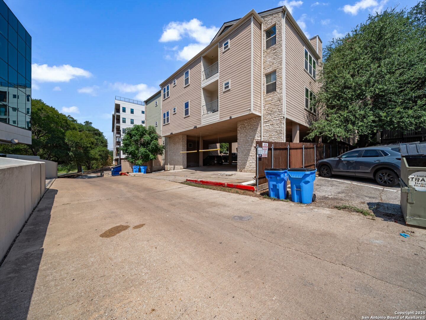 2414 Longview Street, Unit 307 Austin, TX 78705 - Photo 3 of 26 a front view of a building with parking