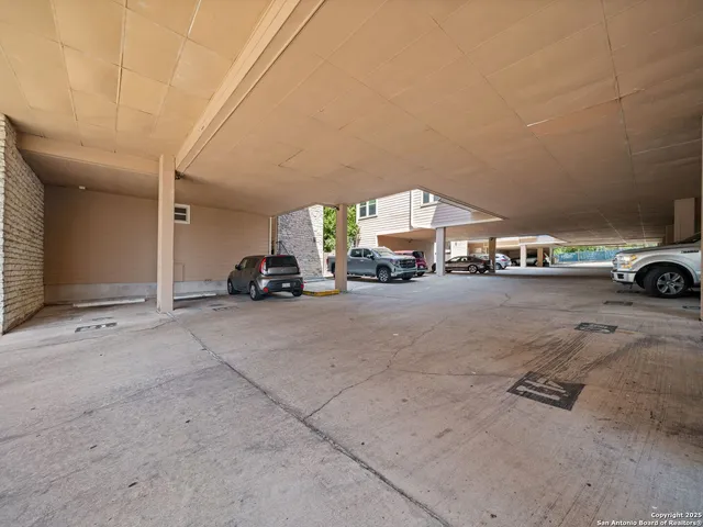 a view of parking area and car parked
