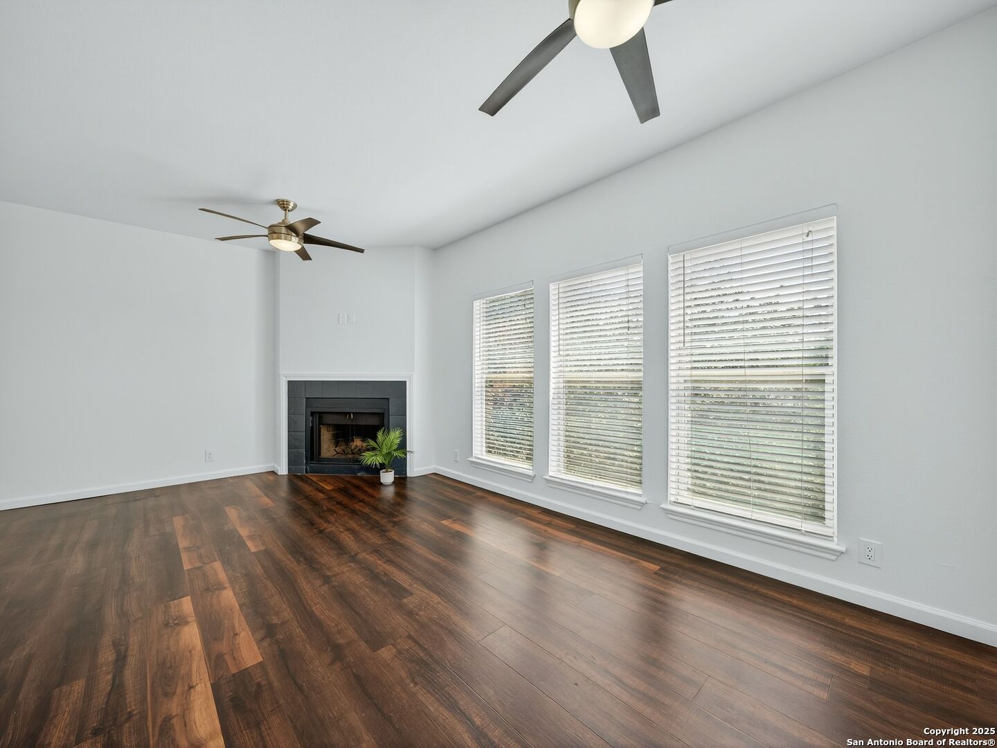 2414 Longview Street, Unit 307 Austin, TX 78705 - Photo 8 of 26 a view of an empty room with a window and wooden floor