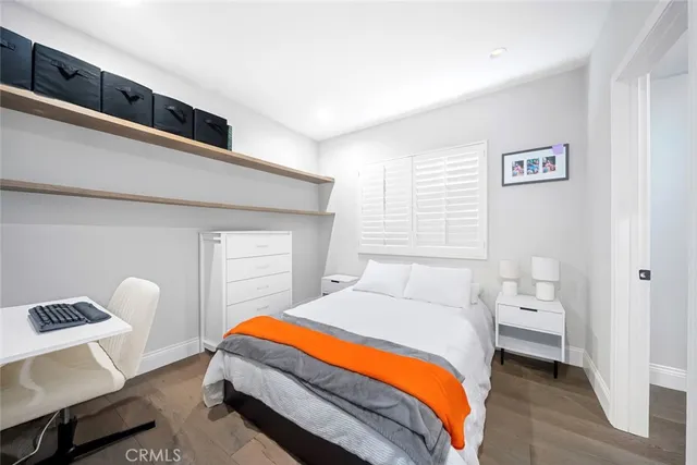 a bedroom with a bed and a lamp