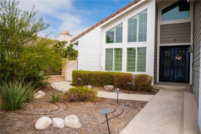 a balcony with furniture and a potted plant