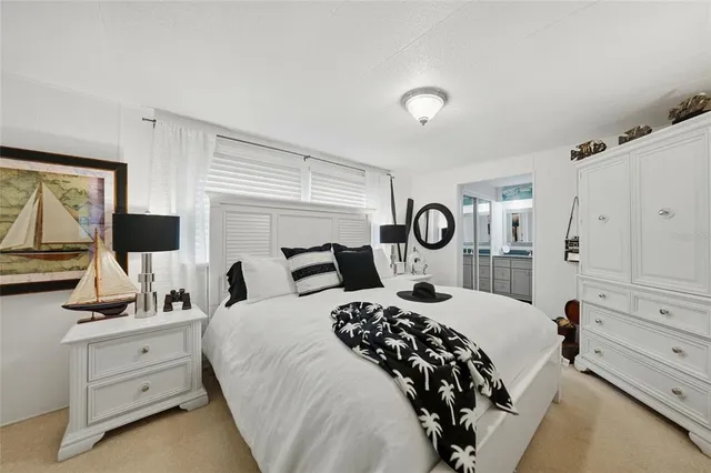 a spacious bathroom with a granite countertop sink mirror and toilet