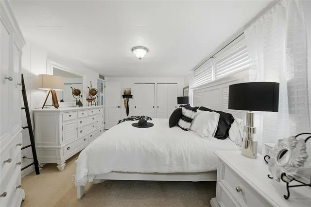 a bedroom with furniture and a bed