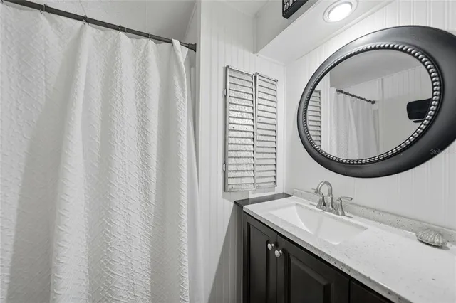 an aerial view of a house with a yard and potted plants