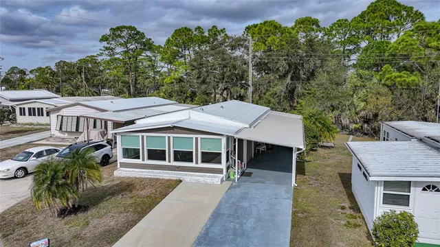 an aerial view of residential houses with outdoor space
