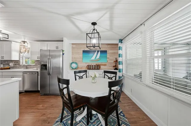 a large kitchen with cabinets and stainless steel appliances