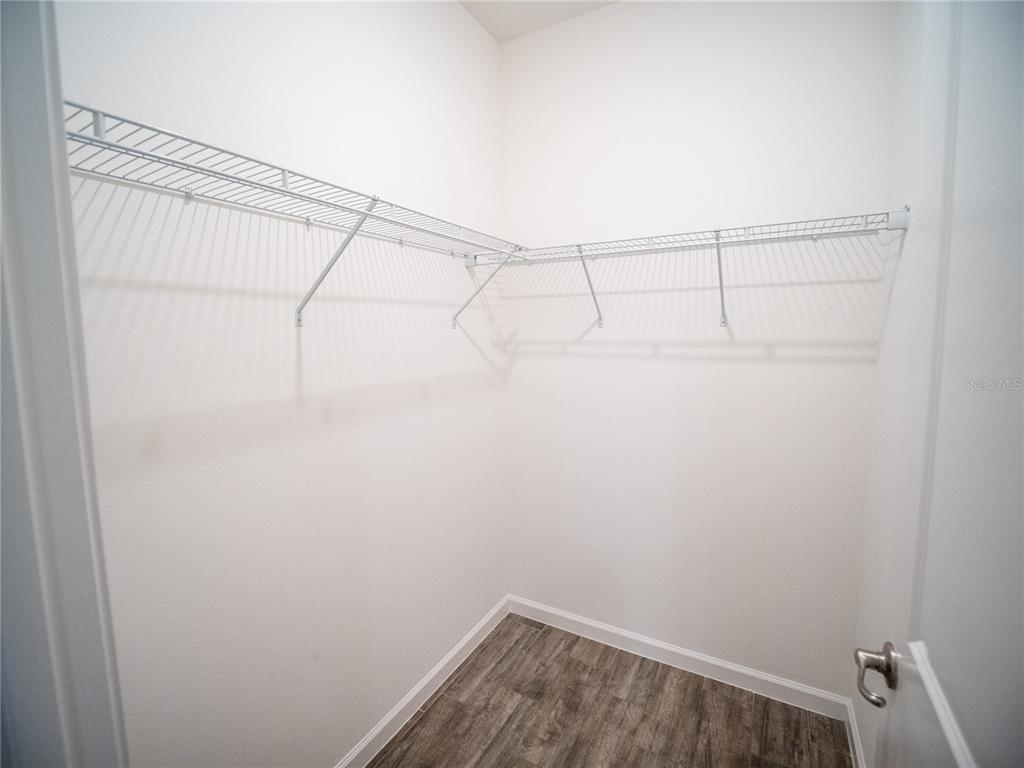 1257 Hendon Loop Davenport, FL 33837 - Photo 16 of 16 a view of a room with racks on the wall