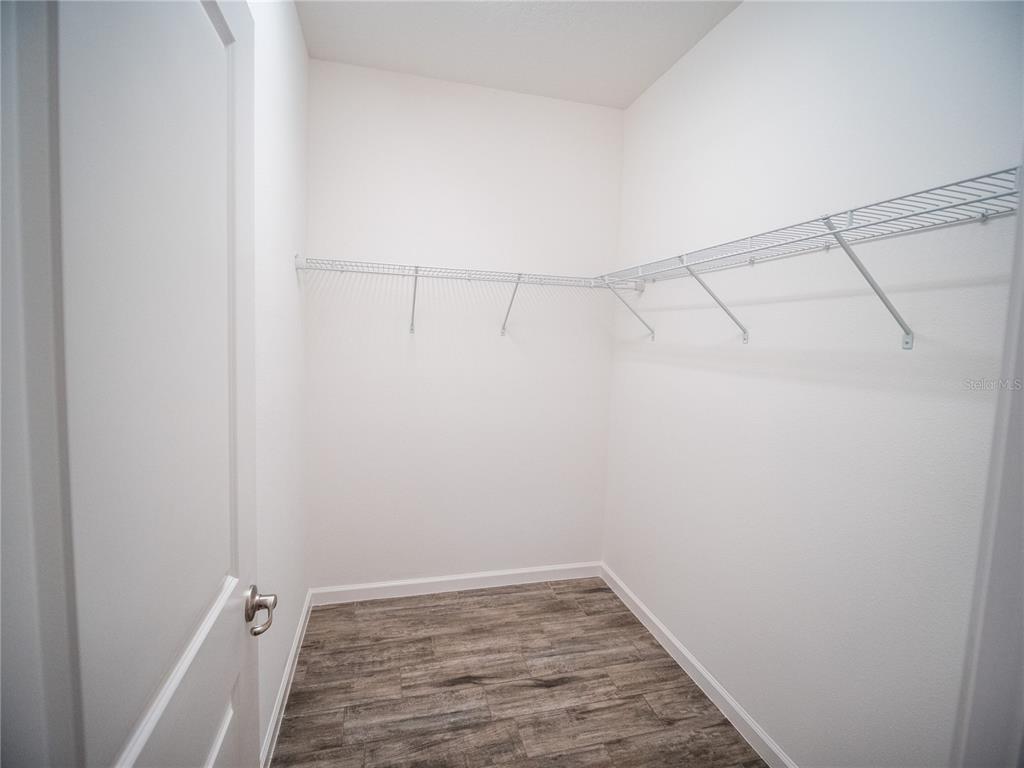 1257 Hendon Loop Davenport, FL 33837 - Photo 7 of 16 a view of a room with wooden floor