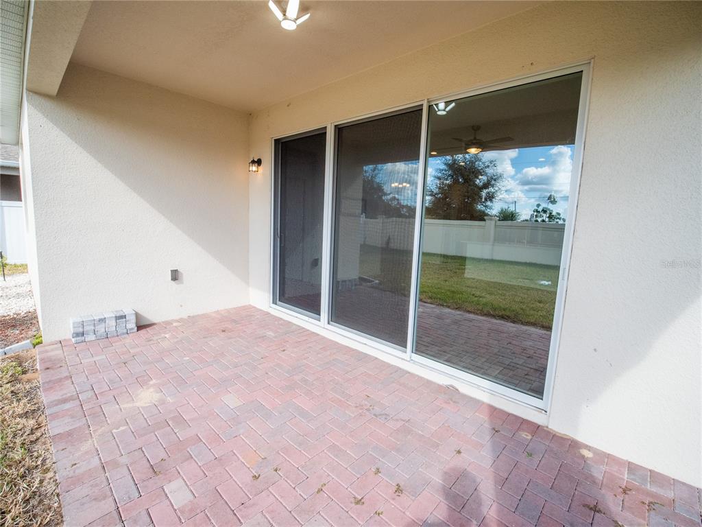 1257 Hendon Loop Davenport, FL 33837 - Photo 8 of 16 a view of empty room with wooden floor and fan