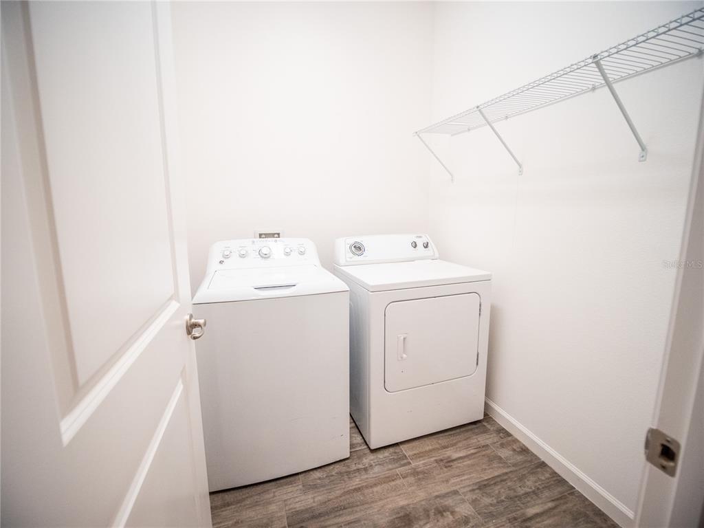 1257 Hendon Loop Davenport, FL 33837 - Photo 10 of 16 a utility room with dryer and washer
