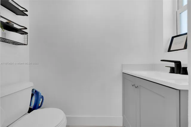 a bathroom with a toilet and a sink