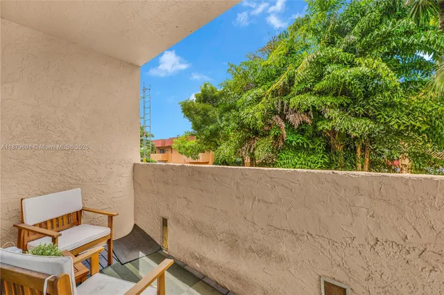 a view of a chairs and table in a outdoor space