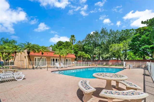 a view of a backyard with palm tree