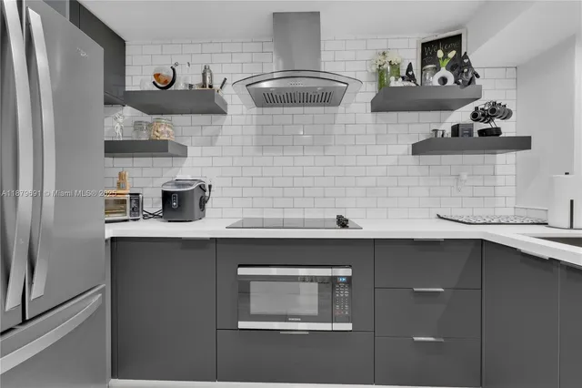 a sink with cabinets and wooden floor
