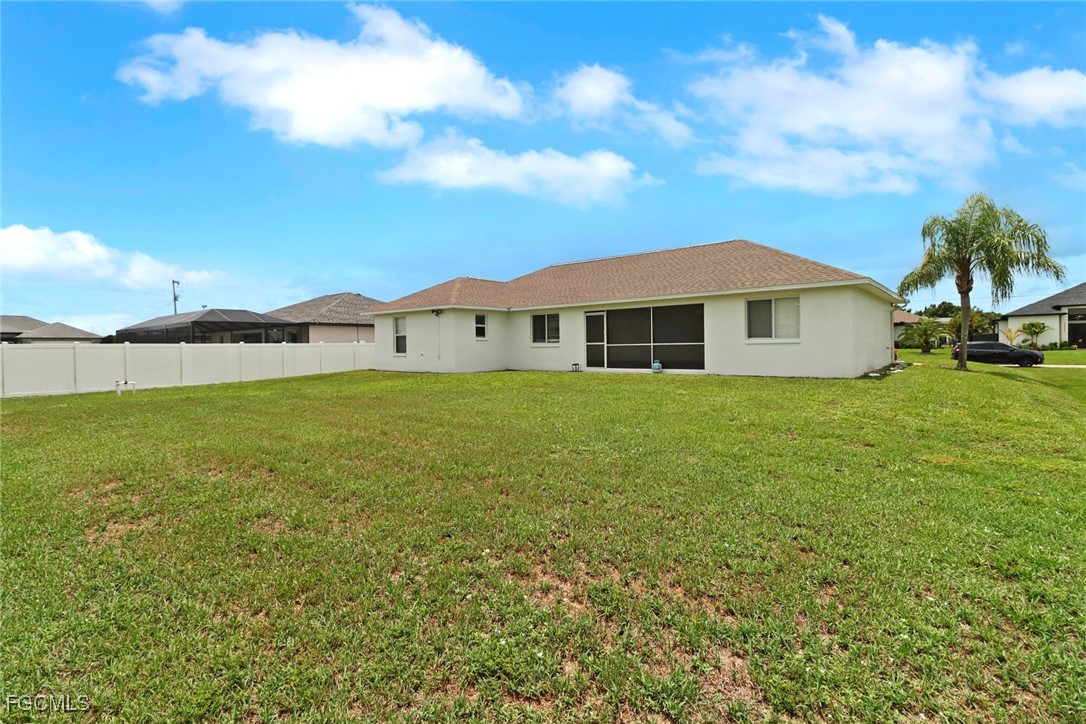 2223 Southwest 16th Terrace Cape Coral, FL 33991 - Photo 2 of 11 a view of a house with a yard and sitting area