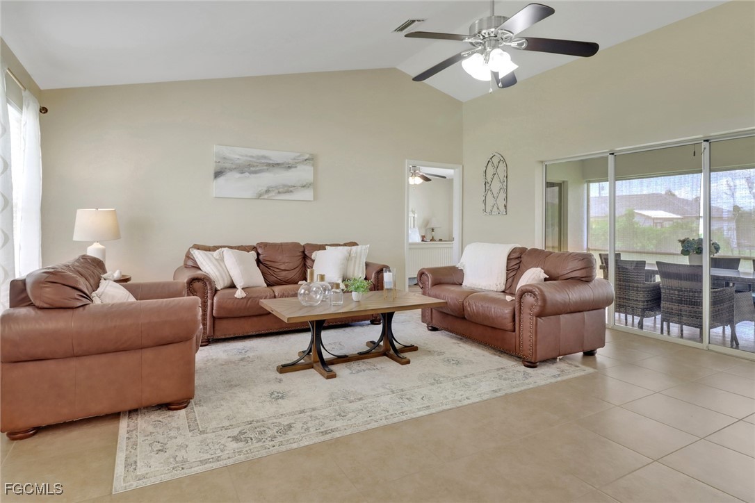 2223 Southwest 16th Terrace Cape Coral, FL 33991 - Photo 4 of 11 a living room with furniture and a large window