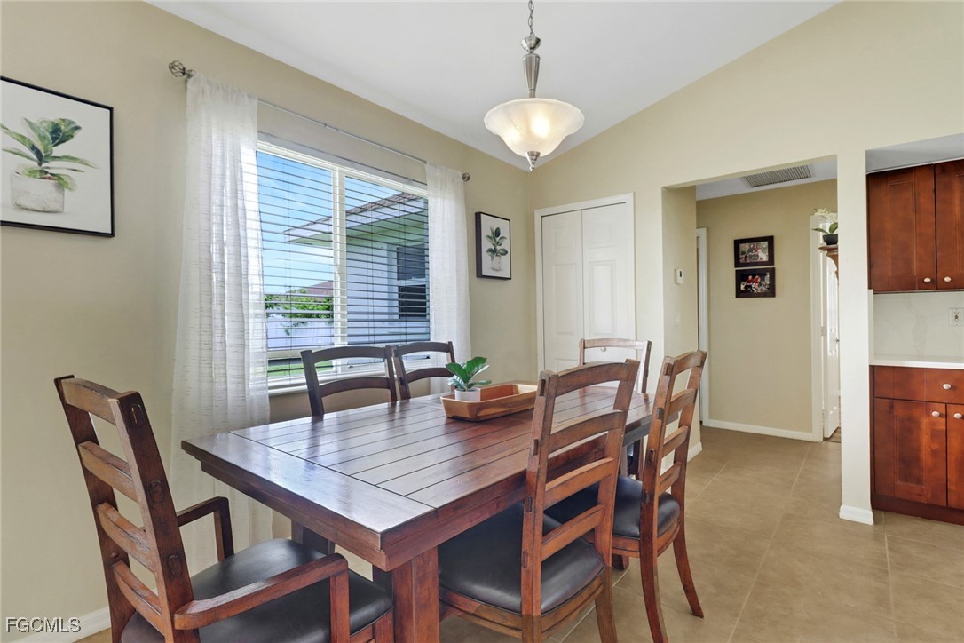 2223 Southwest 16th Terrace Cape Coral, FL 33991 - Photo 5 of 11 a view of a dining room with furniture