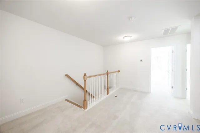 an empty room with white walls and white walls