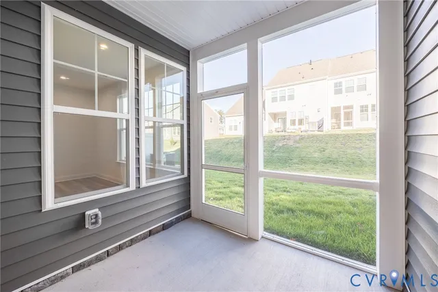 a view of a room that has a large window