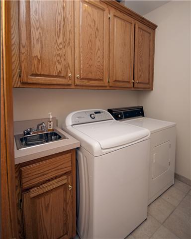 245 Quarry Road Mount Juliet, TN 37122 - Photo 14 of 19 The laundry room is located off the kitchen and includes a small washing sink and cabinets to store all of those laundry necessities or perhaps could be used as extra storage for those linens. The washer and dryer do remain with the home.